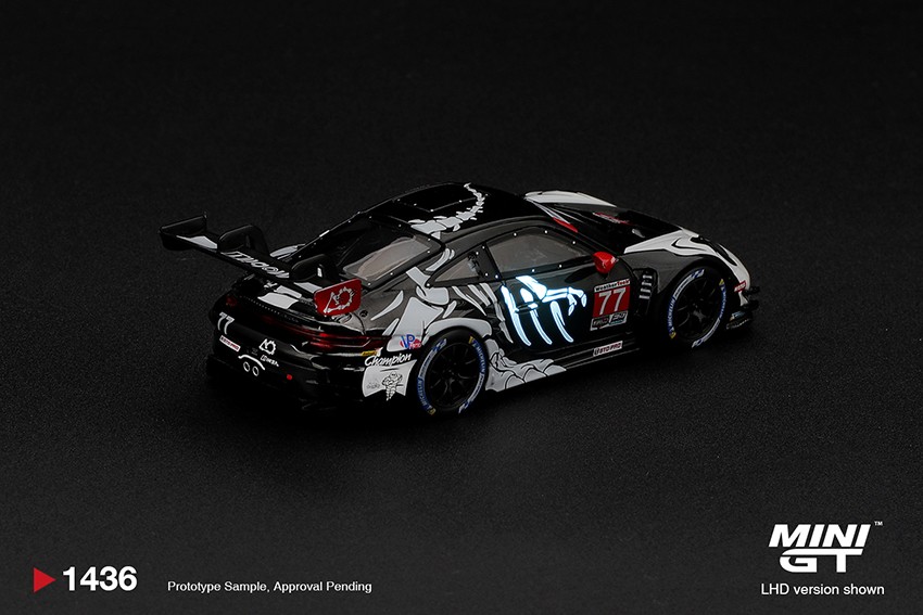 1:64 Scale. Porsche 911 GT3 R (992) #77 AO Racing "Skeleton Rexy" 2026 IMSA Petit Le Mans. MINI GT (boxed)