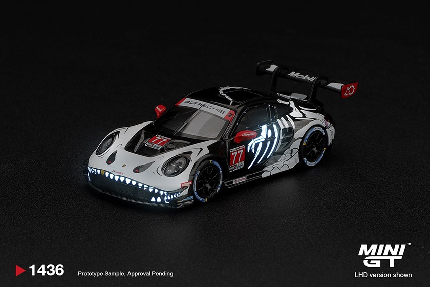 1:64 Scale. Porsche 911 GT3 R (992) #77 AO Racing "Skeleton Rexy" 2026 IMSA Petit Le Mans. MINI GT (boxed)